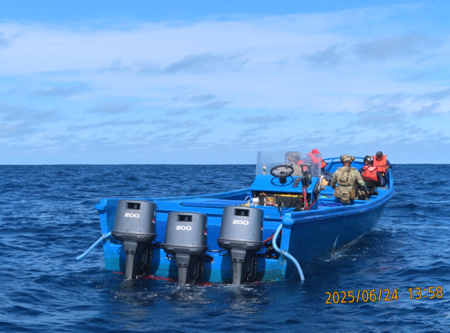A Coast Guard small boat crew boarding a vessel suspected of drug smuggling operations approximately 120 miles northwest of Ecuador. U.S. Coast Guard Cutter Tahoma’s crew offloaded approximately 9,970 pounds of cocaine worth $73.7 million, Tuesday, at Port Everglades. (Courtesy asset)