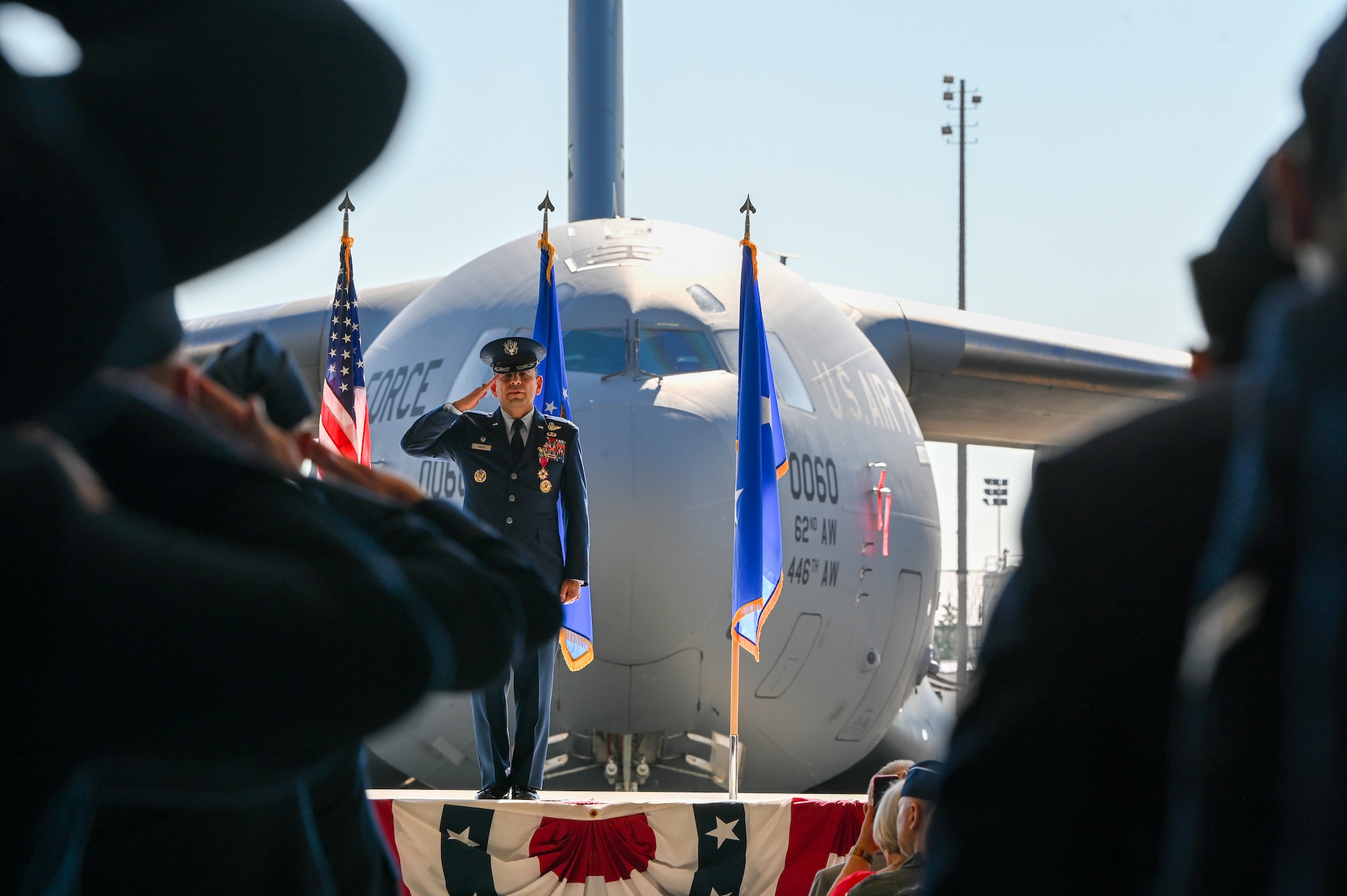 U.S. Air Force Col. Sergio Anaya, outgoing 62d Airlift Wing commander, gives a final salute to the Airmen of the 62d AW, during a change of command ceremony at Joint Base Lewis-McChord, Washington, July 29, 2025.