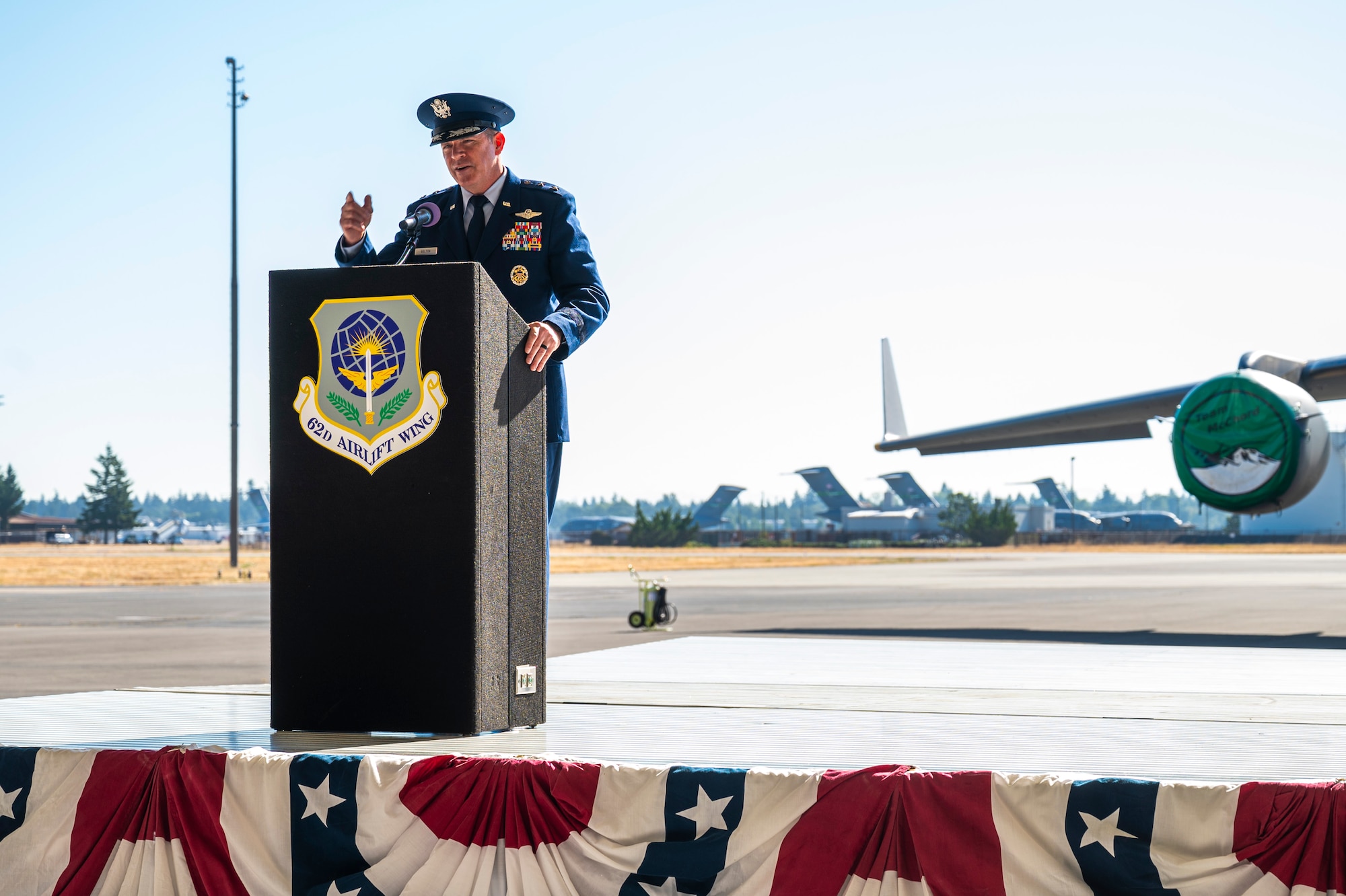 U.S. Air Force Maj. Gen. Charles Bolton, Eighteenth Air Force commander, gives remarks during the 62d Airlift Wing change of command ceremony at Joint Base Lewis-McChord, Washington, July 29, 2025.
