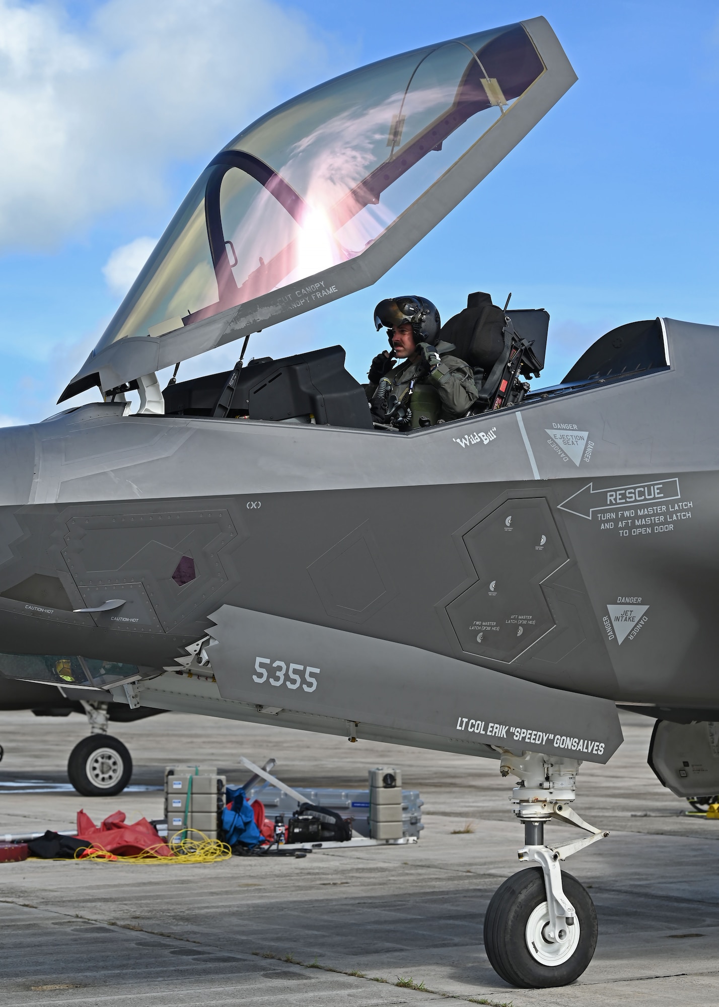 U.S. Air Force Lt. Col. Erik Gonsalves, 355th Mission Generation Force Element commander, fastens his helmet before a flight during exercise Resolute Force Pacific 2025, July 17, 2025.