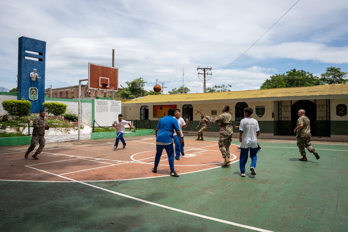 U.S. Airmen participating in AMISTAD 2025 play basketball with Salvadoran youth in Santa Ana, El Salvador, June 24, 2025. AMISTAD, Spanish word for “friendship,” is an Air Forces Southern led multinational campaign of Global Health Engagements comprised of missions that deliver direct patient care in Latin American countries by joint, total force and multi-disciplinary medical teams. (U.S. Air Force photo by Staff Sgt. Joshua Hastings)
