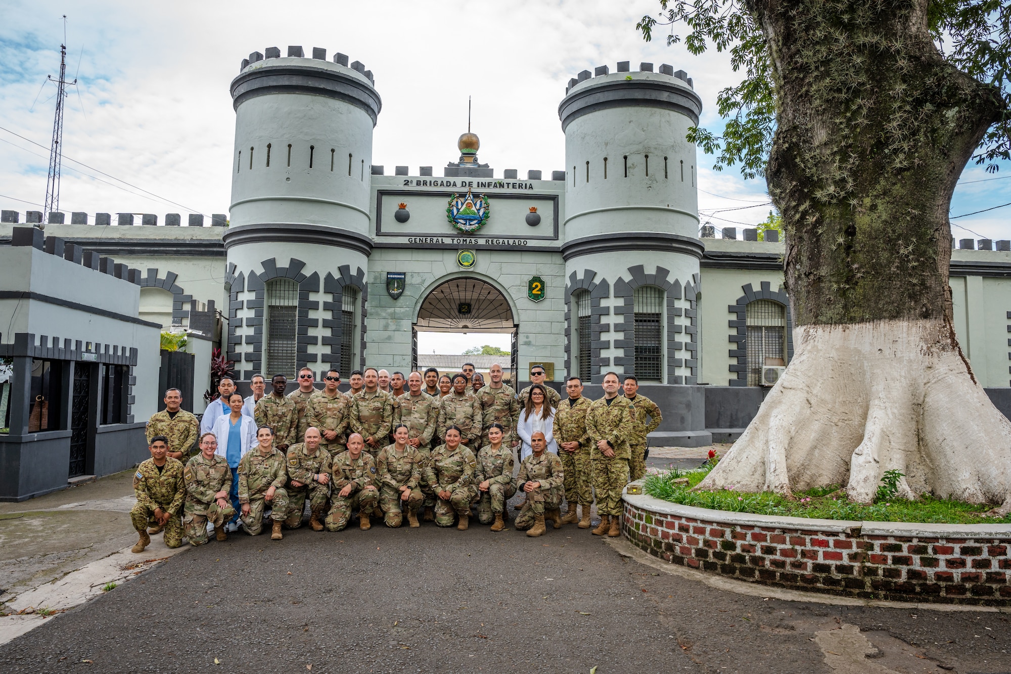 U.S. Air Force and Salvadoran health professionals participating in AMISTAD 2025 pose for a group photo following a community event in Santa Ana, El Salvador, June 24, 2025. AMISTAD, also the Spanish word for “friendship,” is an Air Forces Southern led multinational campaign of Global Health Engagements comprised of missions that deliver direct patient care in Latin American countries by joint, total force and multi-disciplinary medical teams. U.S. Air Force, Canadian Armed Forces and Salvadoran health professionals offered medical services including dental, pharmaceutical, pediatric, mental health and primary care to members of the local community during the event. (U.S. Air Force photo by Staff Sgt. Joshua Hastings) (U.S. Air Force photo by Staff Sgt. Joshua Hastings)
