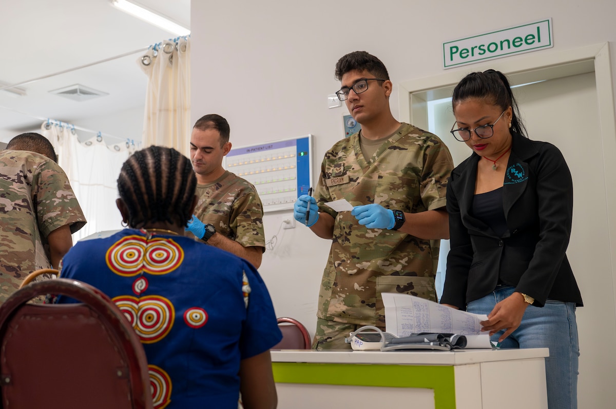 U.S. Airmen work with hospital staff to provide family medicine care to Surinamese locals at Regional Hospital Wanica during AMISTAD 2025 in Lelydorp, Suriname, July 23, 2025. Direct patient care missions like AMISTAD send joint, total force, multi-disciplinary medical and surgical support teams to provide care in underserved populations across Latin America and the Caribbean. (U.S. Air Force photo by Senior Airman Devlin Bishop)