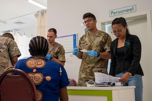 U.S. Airmen work with hospital staff to provide family medicine care to Surinamese locals at Regional Hospital Wanica during AMISTAD 2025 in Lelydorp, Suriname, July 23, 2025. Direct patient care missions like AMISTAD send joint, total force, multi-disciplinary medical and surgical support teams to provide care in underserved populations across Latin America and the Caribbean. (U.S. Air Force photo by Senior Airman Devlin Bishop)