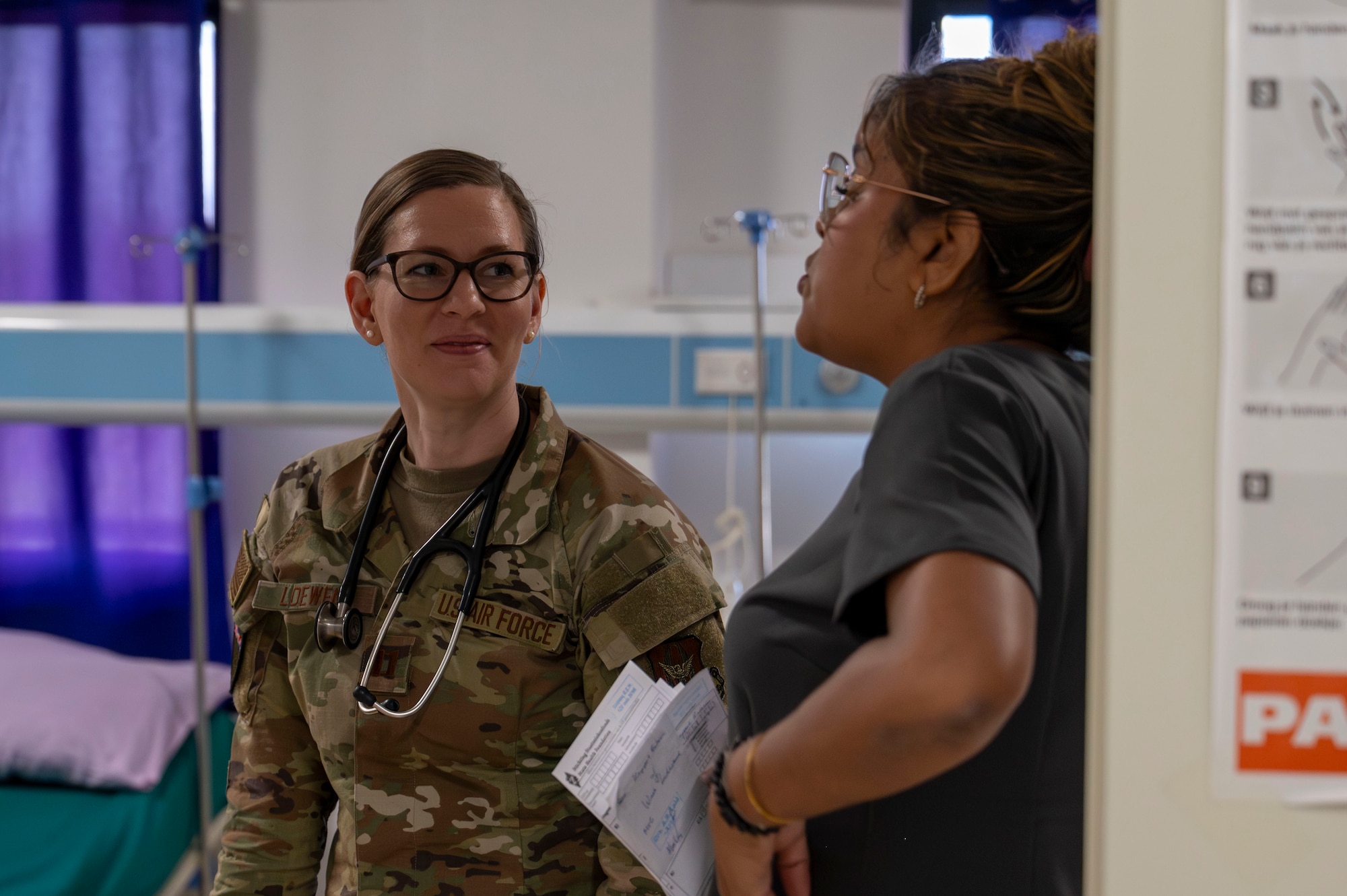 U.S. Air Force Capt. Tiffany Loewen, 931st Aerospace Medicine Squadron nurse practitioner, discusses patient care with hospital personnel at Regional Hospital Wanica during AMISTAD 2025 in Lelydorp, Suriname, July 23, 2025. Medical readiness across the Western Hemisphere depends on trust, training, and interoperability—AMISTAD delivers all three. (U.S. Air Force photo by Senior Airman Devlin Bishop)