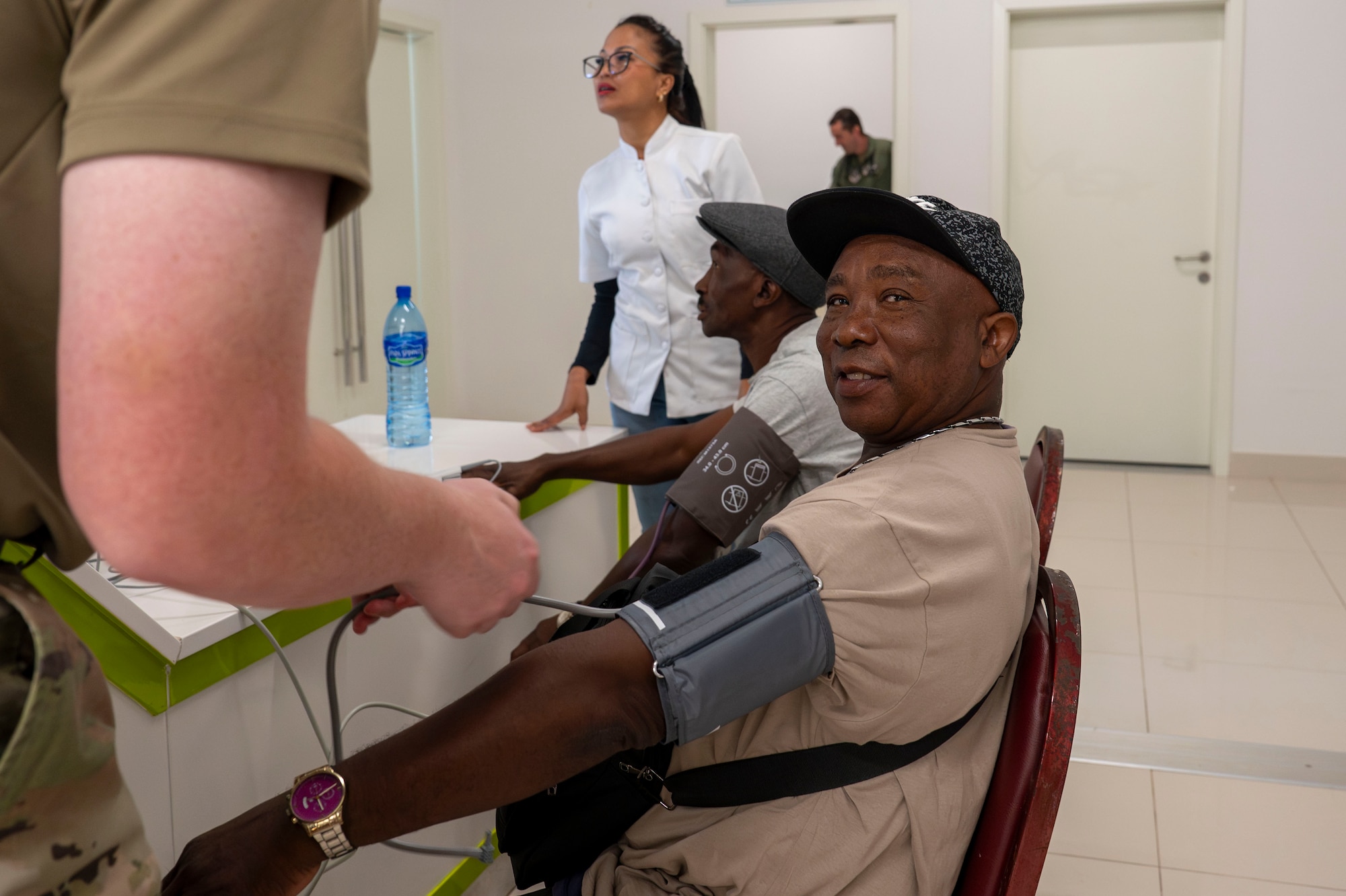 A U.S. Airman checks a Surinamese patient’s blood pressure at Regional Hospital Wanica during AMISTAD 2025 in Lelydorp, Suriname, July 24, 2025. AMISTAD is a symbol of partnership through medical readiness, underscoring a steadfast commitment in support of mutual goals and to further strengthen security ties between the U.S. and partner nations. (U.S. Air Force photo by Senior Airman Devlin Bishop)