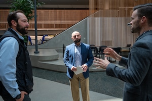Special Agents Dante Tabarracci and Kevin Alexander receive a briefing inside a private-sector facility in San Francisco, May 15, 2025.