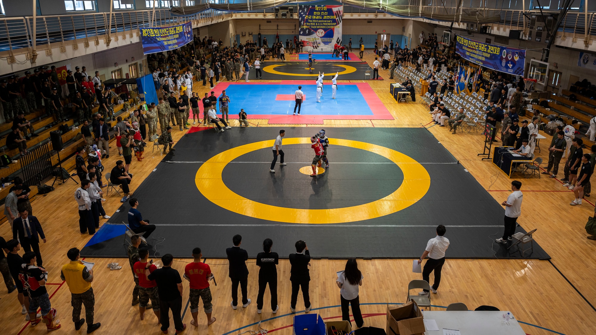 U.S. and Republic of Korea service members compete in the 2025 ROK-US Combat Taekwondo Exhibition at Osan Air Base, Republic of Korea, July 26, 2025. The exhibition allowed service members to experience the rich traditions of South Korea, reinforcing the strong diplomatic and military relationship between the two nations. (U.S. Air Force photo by Senior Airman Rome Bowermaster)