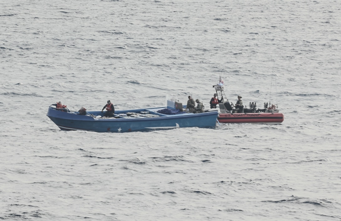 A Coast Guard small boat crew boarding a vessel suspected of drug smuggling operations approximately 120 miles northwest of Ecuador. U.S. Coast Guard Cutter Tahoma’s crew offloaded approximately 9,970 pounds of cocaine worth $73.7 million, Tuesday, at Port Everglades. (Courtesy asset)