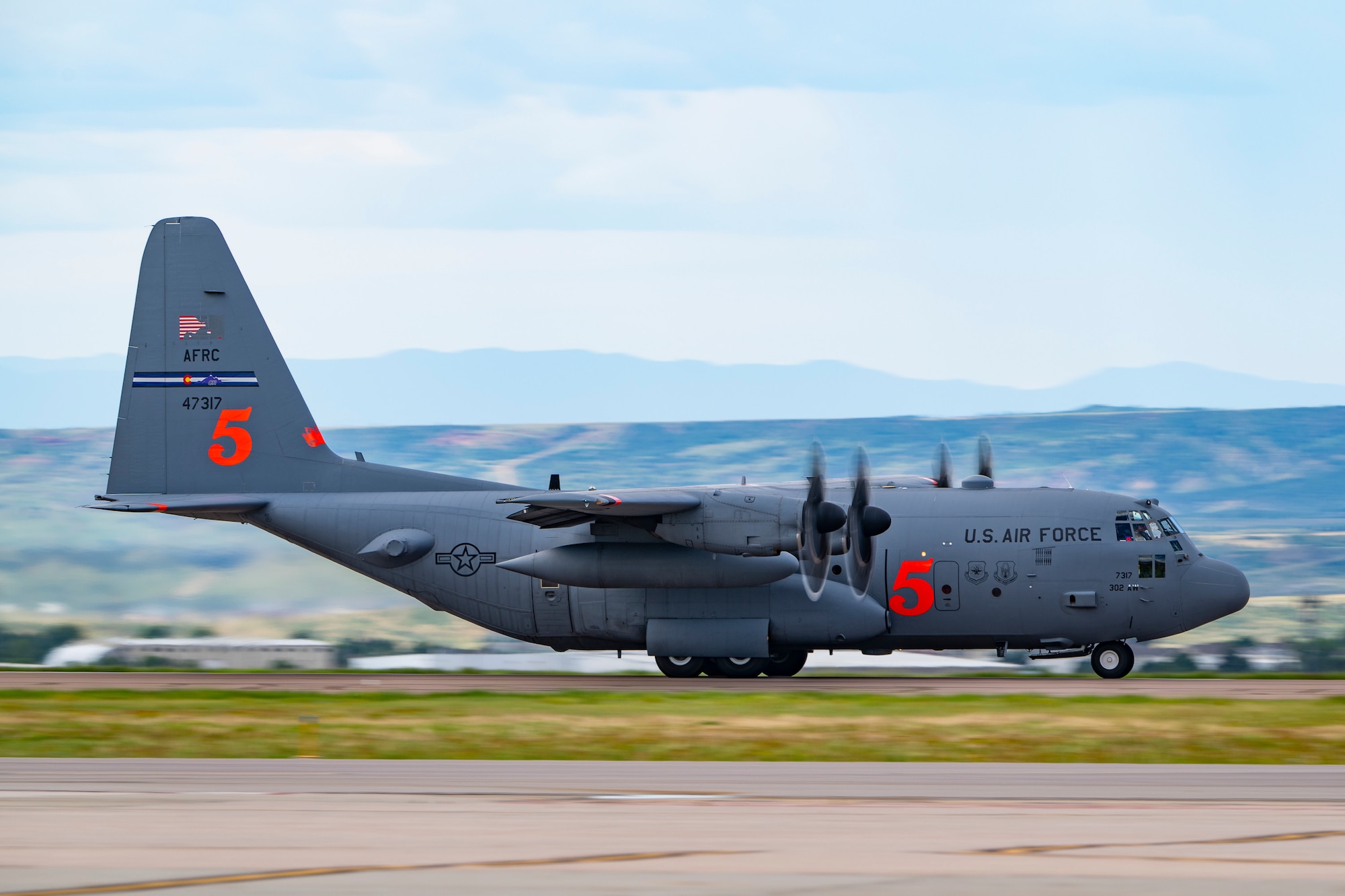 A military aircraft taking off.