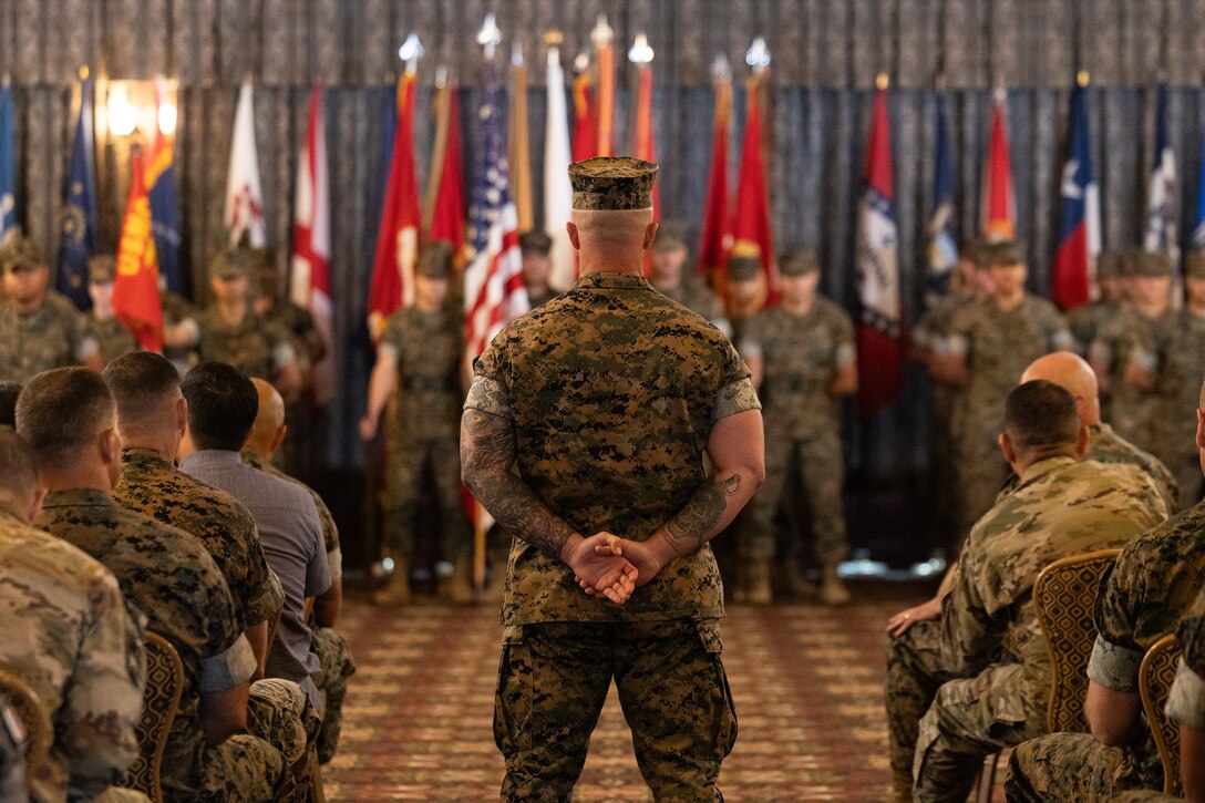 U.S. Marine Corps 1st Sgt. Hunter Misner, first sergeant for Bravo Company, Headquarters and Support Battalion, Marine Corps Installations Pacific, leads the formation during a relief and appointment ceremony on Camp Foster, Okinawa, Japan July 8, 2025. Sgt. Maj. Anthony Easton, the outgoing sergeant major of MCIPAC, was relieved by Sgt. Maj. Jorge Ortiz, who previously served as the sergeant major of Headquarters and Service Battalion, U.S. Marine Corps Forces, Pacific. Ortiz enlisted in the Marine Corps in 2000 and was previously stationed at Camp Smith, Hawaii. Misner is a native of Florida. (U.S. Marine Corps photo by Lance Cpl. Brody Robertson)