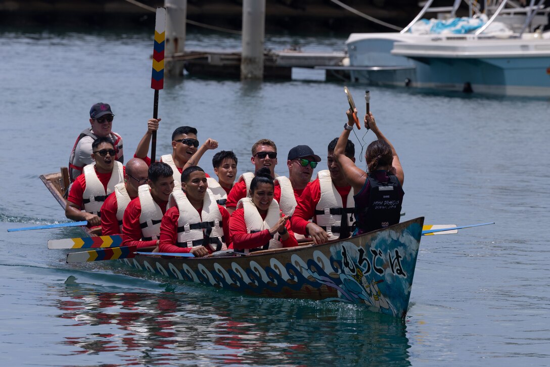 U.S. Marines with Headquarters and Headquarters Squadron, Marine Corps Air Station Futenma, participate in the Ginowan Dragon Boat Race. Forty teams, including Das Boots, Hornet Harbingers and Yasha Dragons from MCAS Futenma, competed for top five honors in the timed event. (U.S. Marine Corps photo by Lance Cpl. Alexander Conde)