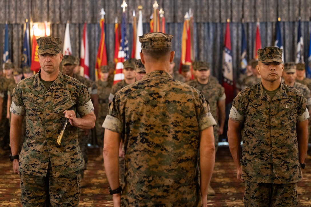 U.S. Marine Corps Sgt. Maj. Anthony Easton, the outgoing sergeant major for Marine Corps Installations Pacific, Maj. Gen. Brian Wolford, commanding general of MCIPAC, and Sgt. Maj. Jorge Ortiz, incoming sergeant major of MCIPAC, stand at attention during a relief and appointment ceremony on Camp Foster, Okinawa, Japan July 8, 2025. Easton a native of Minnesota, was relieved by Ortiz a native of California, who previously served as the sergeant major of Headquarters and Service Battalion, U.S. Marine Corps Forces, Pacific. Ortiz enlisted in the Marine Corps in 2000 and was previously stationed at Camp Smith, Hawaii. Wolford is a native of Maryland. (U.S. Marine Corps photo by Lance Cpl. Brody Robertson)
