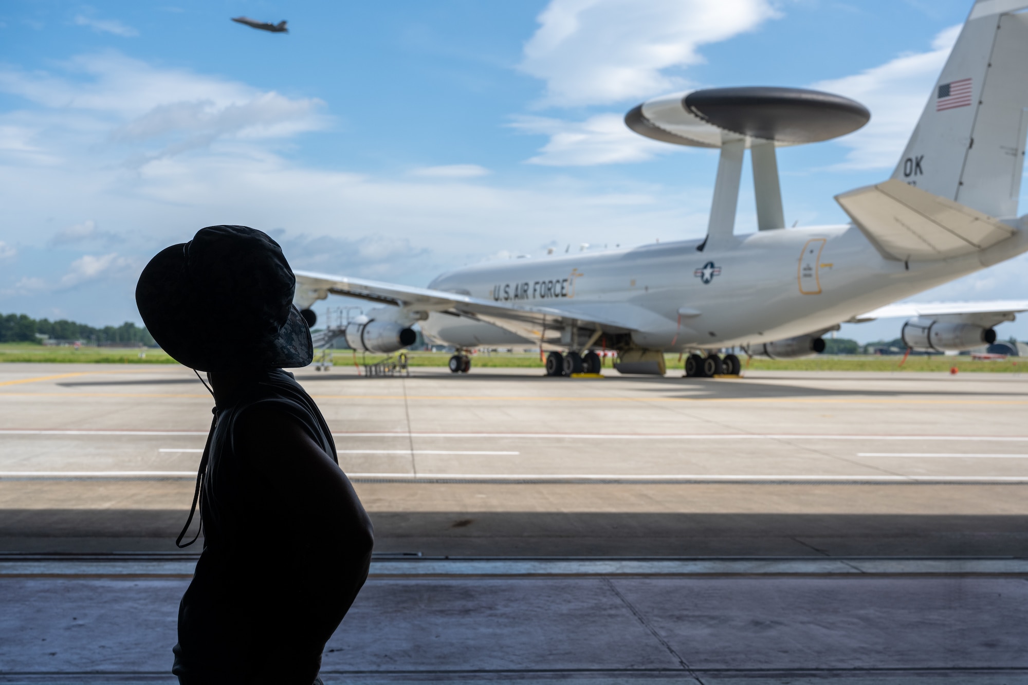 Japan Air Self-Defense Force (JASDF) Master Sgt. Yamamoto Tagaya, 3rd Air Wing Transportation Squadron support unit, watches a JASDF F-35 Lightning II take off during exercise Resolute Force Pacific (REFORPAC) 2025