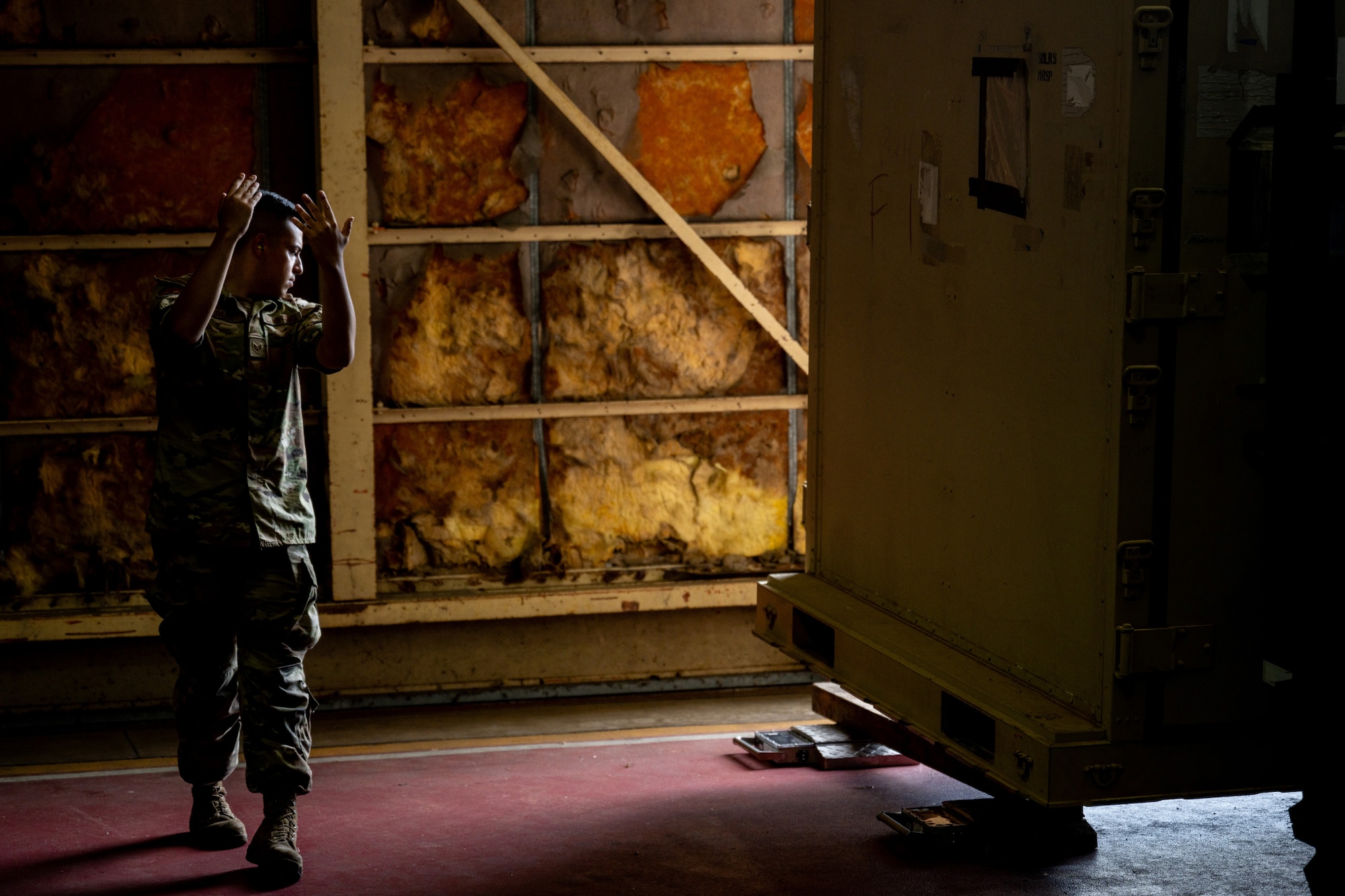 U.S. Air Force Staff Sgt. Noam Naiman, 730th Air Mobility Squadron lead joint inspector, guides a forklift to lower cargo during exercise Resolute Force Pacific (REFORPAC) 2025 at Misawa Air Bas