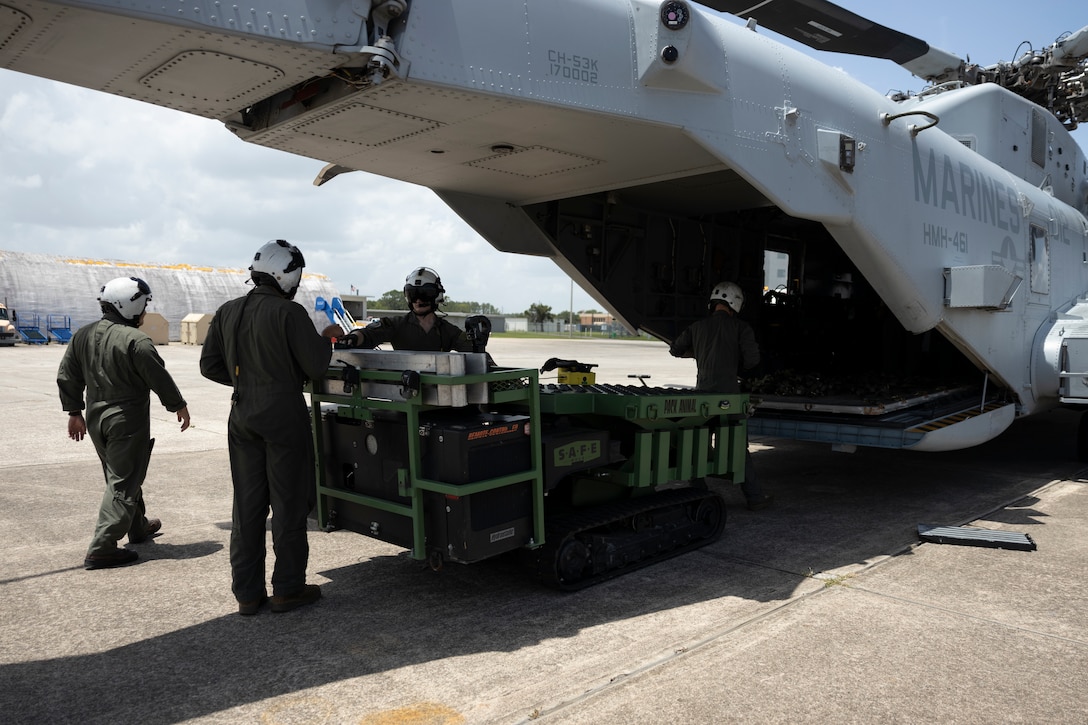 U.S. Marines with Marine Heavy Helicopter Squadron (HMH) 461, Marine Aircraft Group 29, 2nd Marine Aircraft Wing (MAW), load a utility vehicle onto a CH-53K King Stallion at Cecil Airport, Florida, July 25, 2025. Marines with 2nd MAW and 2nd Distribution Support Battalion are training with elements of the U.S. Army, U.S. Navy, and U.S. Customs and Border Protection to refine humanitarian assistance and disaster relief capabilities while also refining the CH-53K’s ability to support distributed aviation operations in a joint environment. (U.S. Marine Corps photo by Cpl. Mya Seymour)