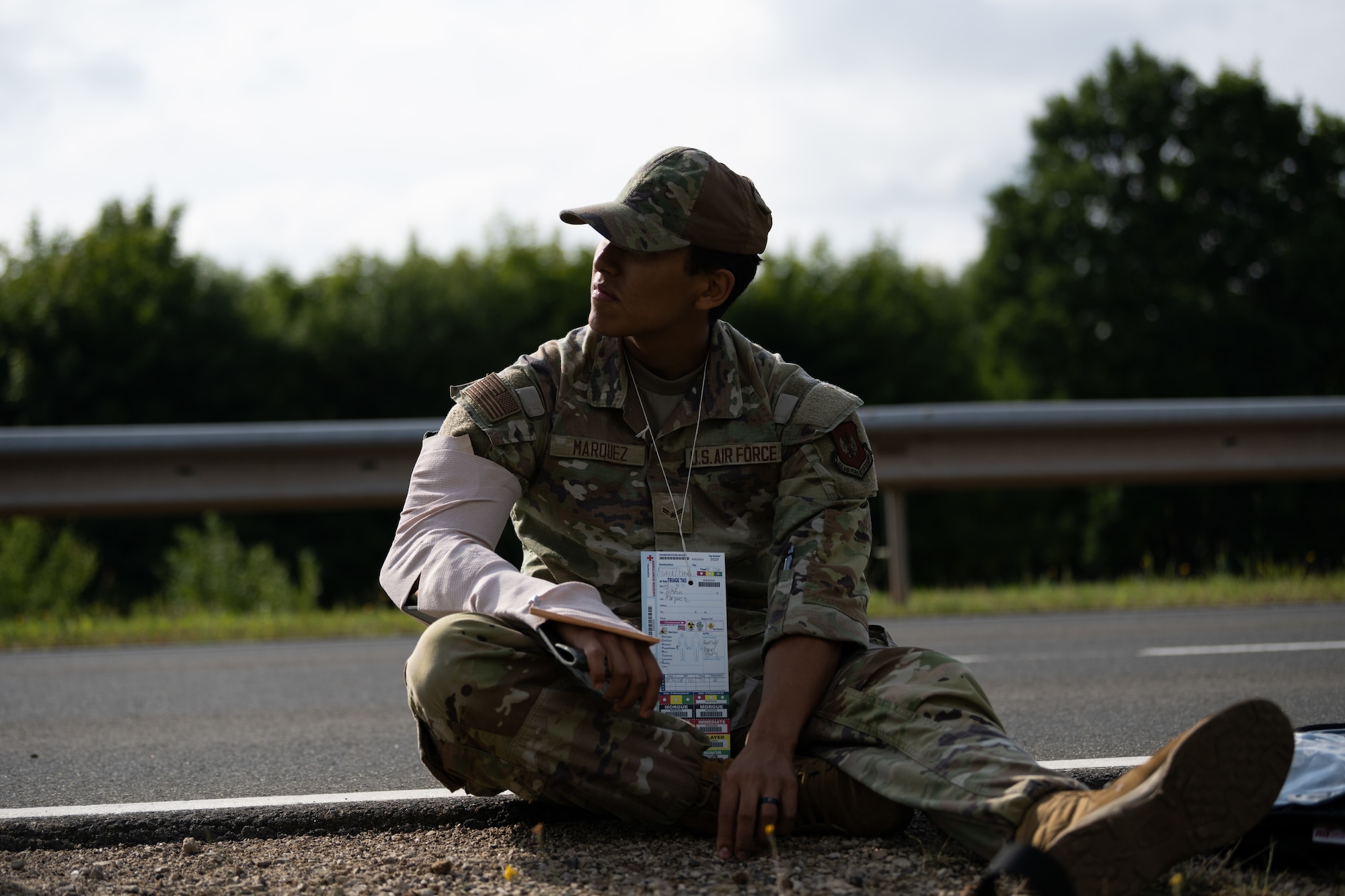 U.S. Air Force Airman 1st Class Tristan Marquez, 52nd Medical Group Warrior Operational Medical Clinic technician, and simulated casualty, awaits treatment during a Major Accident Response Exercise at Spangdahlem Air Base, Germany, July 30, 2025. The MARE tested and evaluated the ability of first responders to identify, triage and treat simulated injuries.