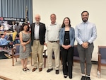 The moderator and panelists gather following the U.S. Naval Research Laboratory’s (NRL) “Pathways to Discovery” panel, July 17, 2025. From left: Pania Newell, Ph.D., moderator and associate professor at the University of Utah; Peter Matic, Ph.D., NRL associate director of research; Andy Nicholas, head of NRL’s Sensor Development and Applications Section; Maggie Stevens, Ph.D., NRL research scientist; and Harry Cole, a returning Naval Research Enterprise Internship Program (NREIP) intern. The event offered career insights to student interns from across NRL’s summer programs.