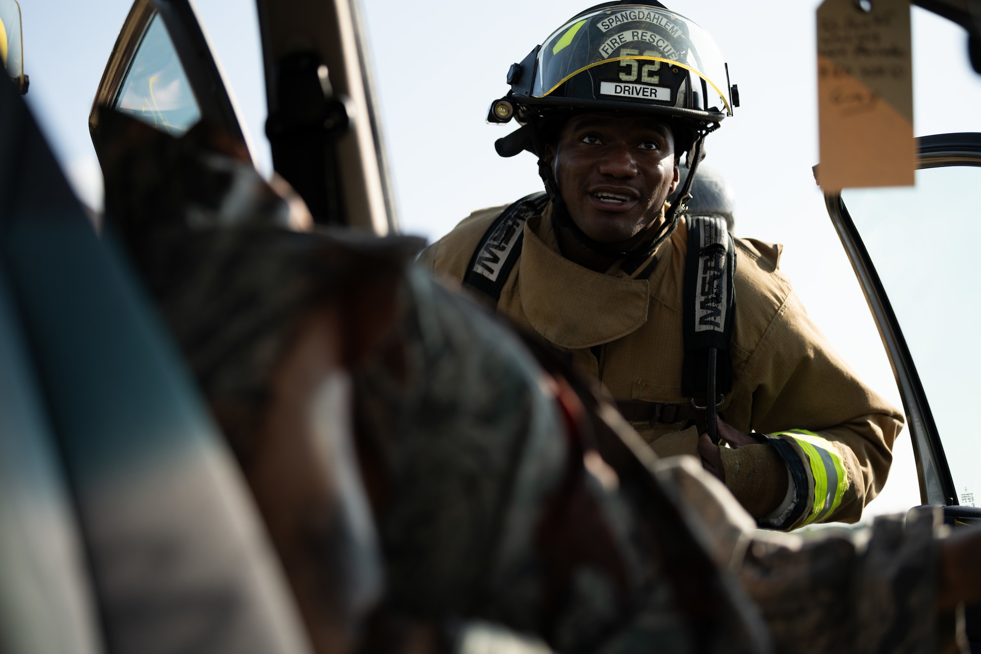 U.S. Air Force Senior Airman Daniel Griffin, 52nd Civil Engineer Squadron fire protection specialist, assesses the condition of a simulated casualty during a Major Accident Response Exercise at Spangdahlem Air Base, Germany, July 30, 2025. During the MARE, emergency responders and support agencies across the installation were tested and evaluated on their ability to mitigate a complex crisis scenario.