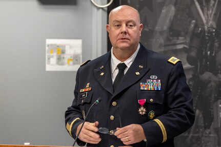 Col. Ralph M. “Mac” Crum, U.S. Army Financial Management Command finance officer, delivers remarks during his retirement ceremony at the Maj. Gen. Emmett J. Bean Federal Center in Indianapolis Nov. 26, 2024. Crum most recently served as USAFMCOM’s chief of staff and served four combat tours during his career. (U.S. Army photo by Brad Staggs)