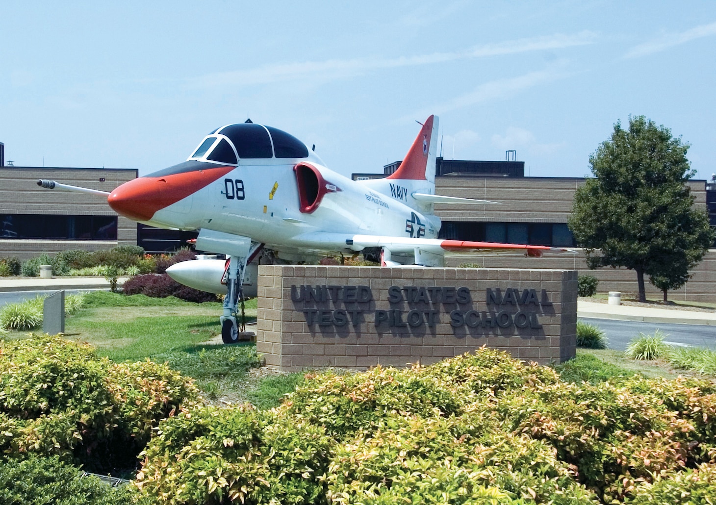 A TA-4J Skyhawk attack aircraft sits in front of the main administration building at the United States Naval Test Pilot School (USNTPS), on board Naval Air Station Patuxent River. USNTPS provides instruction to experienced pilots, flight officers, and engineers in the processes and techniques of aircraft and systems test and evaluation. The school investigates and develops new flight test techniques, publishes manuals for use of the aviation test community for standardization of flight test techniques and project reporting and conducts special projects. USNTPS operates approximately 50 aircraft of 13 types.