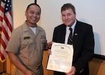 The U.S. Naval Research Laboratory (NRL) Commanding Officer Capt. Randy Cruz presents Scott Browning from NRL’s Signature Technology Office with the Department of the Navy Distinguished Civilian Service Award (DCSA), July 23, 2025, for his service as the technical director and senior advisor from 1991 through 2024. The DCSA is the highest Department of the Navy award for a civilian employee.