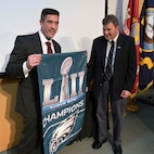 In honor of earning the Distinguished Civilian Service Award (DCSA), Matt Bastow, fellow U.S. Naval Research Laboratory (NRL) Signature Technology Office colleague, presented Scott Browning with a flag honoring Super Bowl LII champions, the Philadelphia Eagles, on July 23, 2025. Both Bastow and Browning are Eagles fans.