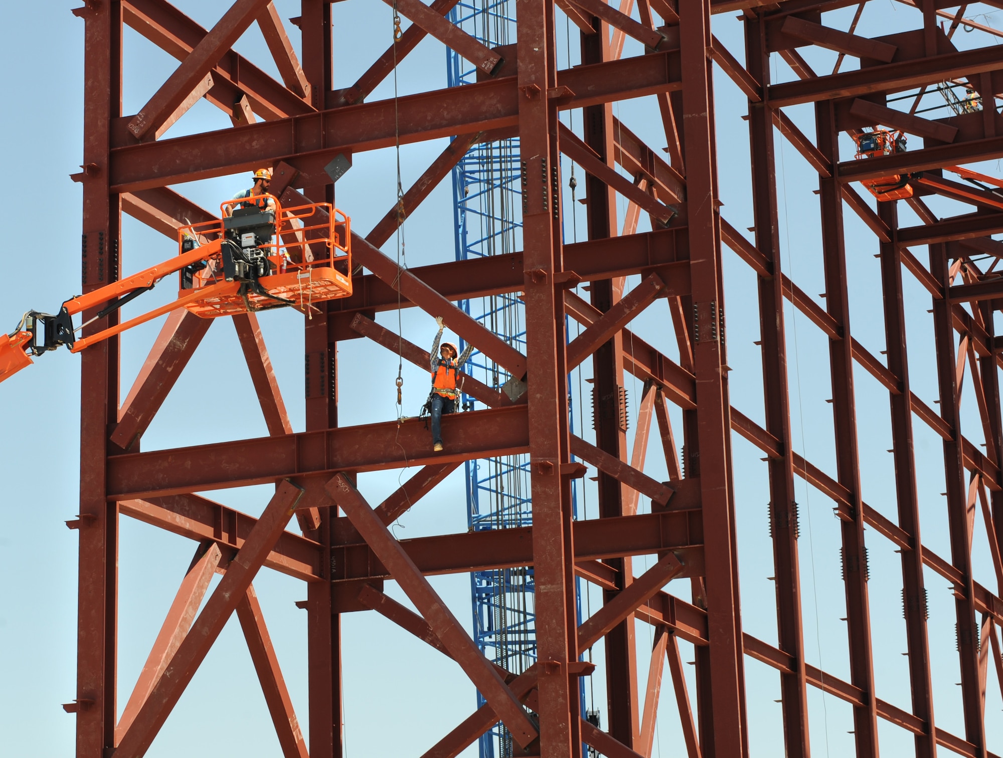 Steel workers maneuver a steel beam into place on the bay door pocket of Hangar 1124, April 30, 2015, at McConnell Air Force Base, Kan. In preparation for the KC-46A Pegasus, 16 construction projects totaling $276 million are scheduled for completion by the end of 2018. McConnell AFB is scheduled to receive its first KC-46A in August 2016. (U.S. Air Force photo by Staff Sgt. Rachel Waller)