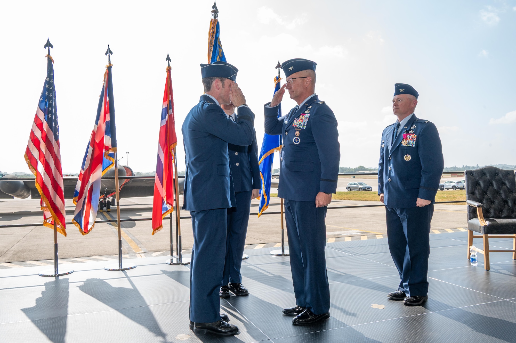 U.S. Air Force Col. Michael J. Jewell, 501st Combat Support Wing (CSW) incoming commander, salutes Maj. Gen. Paul Moga