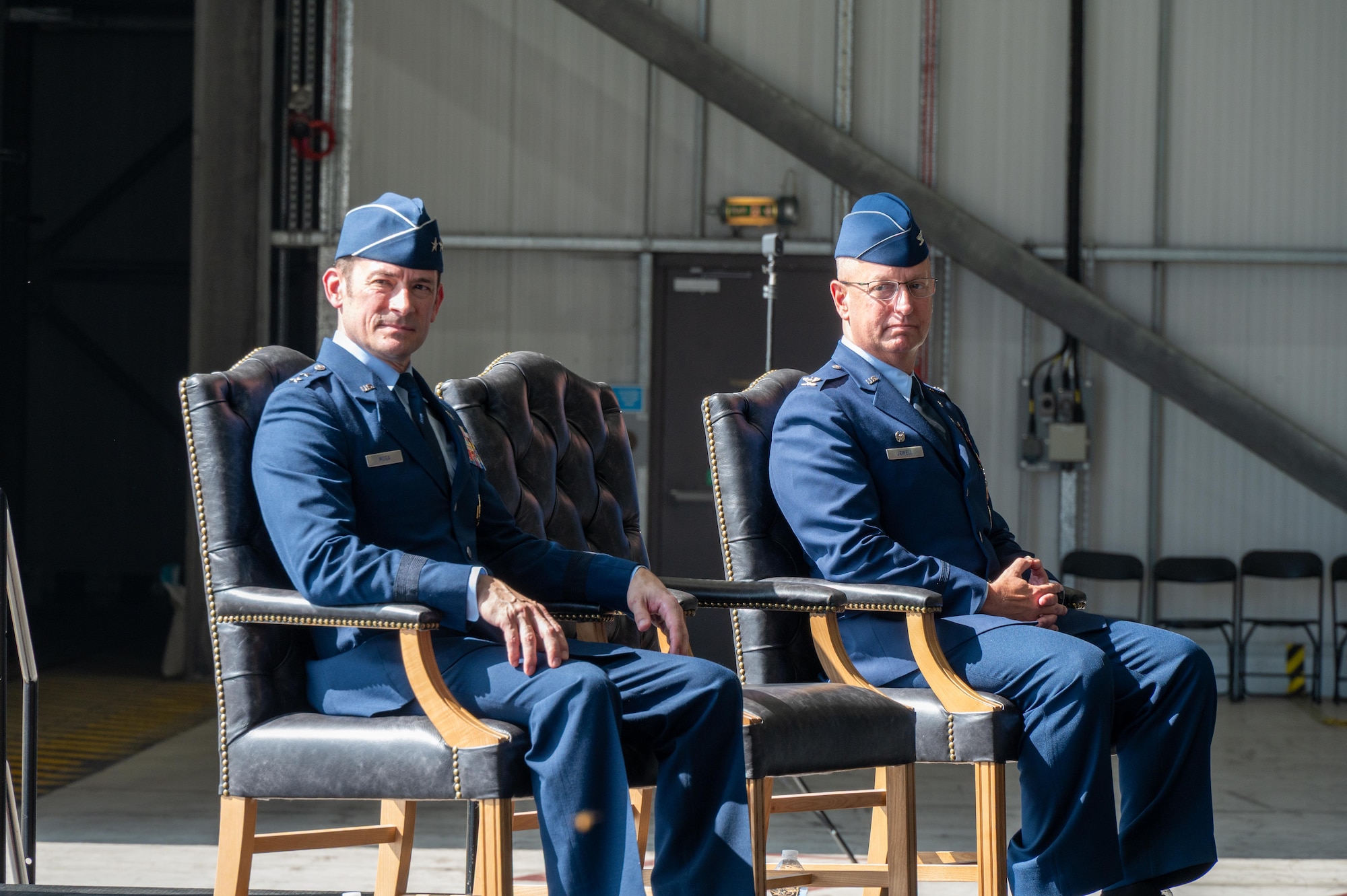U.S. Air Force Maj. Gen. Paul Moga, Third Air Force commander, and Col. Michael J. Jewell, 501st Combat Support Wing (CSW) incoming commander, listen to remarks