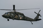 Wisconsin National Guard Soldiers and Airmen demonstrate UH-60 Black Hawk helicopters amid a dramactic display of Pyrotechnics.