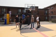 U.S. Marines assigned to Chemical Biological Incident Response Force, play basketball during the Single Marine Program (SMP) “Barracks Bash” event at Naval Support Facility Indian Head, Maryland, June 11, 2025. The SMP is a quality of life program made to boost morale for single service members. This event featured a dunk tank, mechanical bull, axe throwing, and games to encourage social connection and leadership development. (U.S. Marine Corps photo by Lance Cpl. Amy Espinoza)