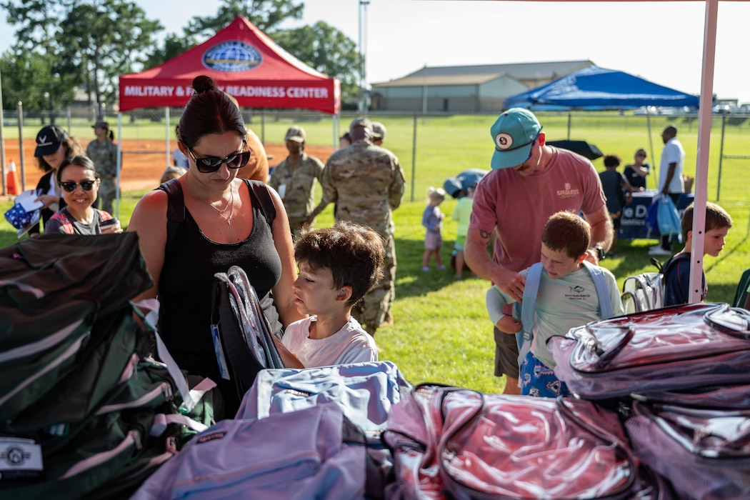 Backpacks were distributed at a BACKpack-to-school Bash.