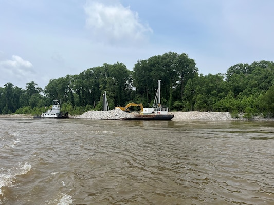U.S. Army Corps of Engineers Memphis District Project Manager Zach Cook and Project Delivery Team members completed a revetment stone repairs project, July 12, in partnership with Commercial Towing Interests, represented by the Lower Mississippi River Committee, and contractor partner, Midwest Construction Company. 

The $1.5 million channel maintenance project placed 32,400 tons of Grade C Stone to repair two existing revetment locations. Revetment is placed against the banks of the river at locations where mainline levees are threatened or where unsatisfactory alignment and channel conditions are developing. 

Repairs will promote riverbank stability and to help maintain a safe and reliable navigation channel at River Miles 952L and 679.5R.