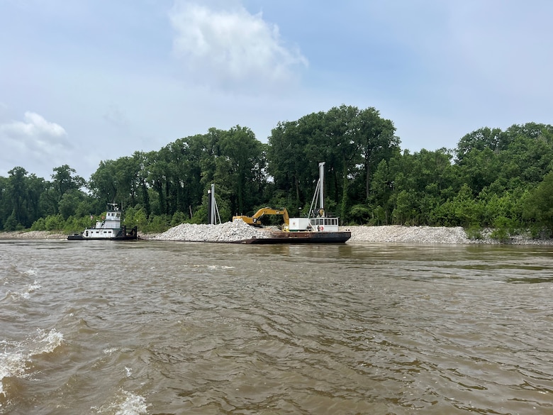 U.S. Army Corps of Engineers Memphis District Project Manager Zach Cook and Project Delivery Team members completed a revetment stone repairs project, July 12, in partnership with Commercial Towing Interests, represented by the Lower Mississippi River Committee, and contractor partner, Midwest Construction Company. 

The $1.5 million channel maintenance project placed 32,400 tons of Grade C Stone to repair two existing revetment locations. Revetment is placed against the banks of the river at locations where mainline levees are threatened or where unsatisfactory alignment and channel conditions are developing. 

Repairs will promote riverbank stability and to help maintain a safe and reliable navigation channel at River Miles 952L and 679.5R.