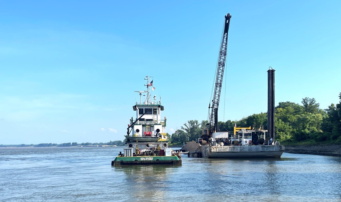 U.S. Army Corps of Engineers Memphis District Project Manager Zach Cook and Project Delivery Team members completed a revetment stone repairs project, July 12, in partnership with Commercial Towing Interests, represented by the Lower Mississippi River Committee, and contractor partner, Midwest Construction Company. 

The $1.5 million channel maintenance project placed 32,400 tons of Grade C Stone to repair two existing revetment locations. Revetment is placed against the banks of the river at locations where mainline levees are threatened or where unsatisfactory alignment and channel conditions are developing. 

Repairs will promote riverbank stability and to help maintain a safe and reliable navigation channel at River Miles 952L and 679.5R.