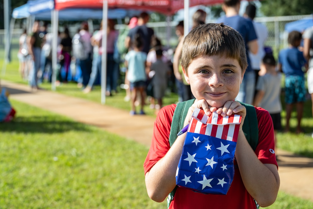 Backpacks were distributed at a BACKpack-to-school Bash.