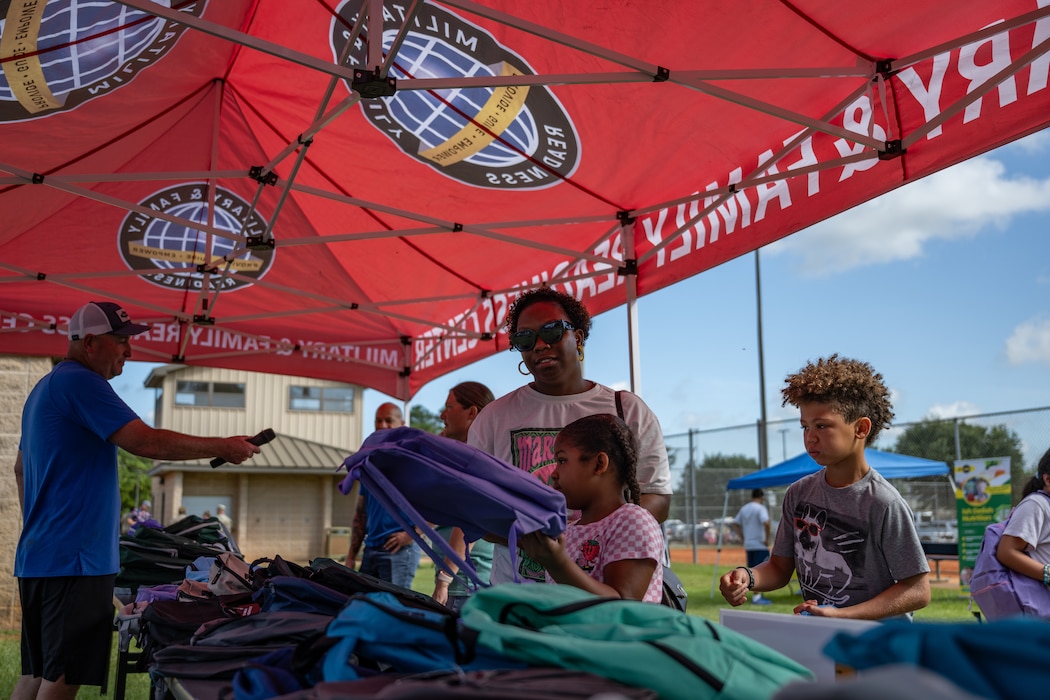 Backpacks were distributed at a BACKpack-to-school Bash.