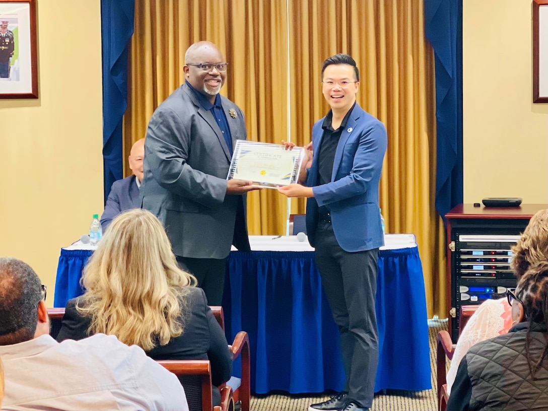 A certificate of appreciation is present to guest speaker.