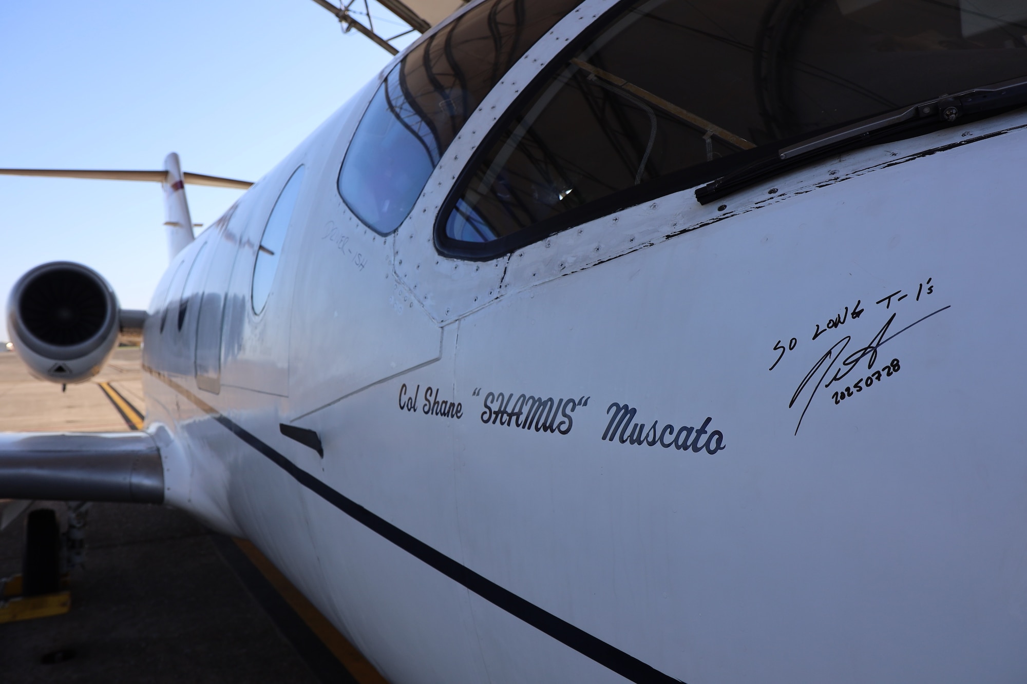 PENSACOLA, Fla. -- The last T-1A Jayhawk onboard Naval Air Station (NAS) Pensacola bears a signature from 479th Flying Training Group (FTG) Commander Col. Shane 'Shamus' Muscato before its final flight July 28. The aircraft’s retirement is part of the Air Force’s larger transition toward a fully modernized CSO training environment.