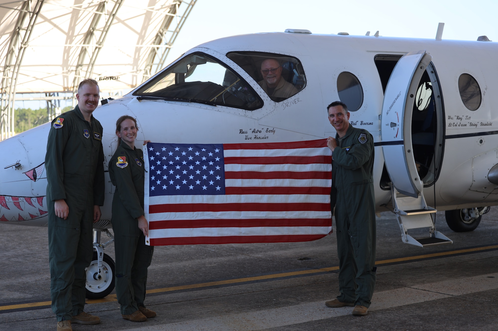 PENSACOLA, Fla. -- Col. Shane 'Shamus' Muscato, the 479th Flying Training Group (FTG) commander, and 479th FTG officers Maj. Christoper Sunnekalb, Capt. Kayla Hamilton and pilot Russel Early pose for a photo with the last T-1A Jayhawk onboard Naval Air Station (NAS) Pensacola before its final flight July 28. The aircraft’s retirement is part of the Air Force’s larger transition toward a fully modernized CSO training environment.