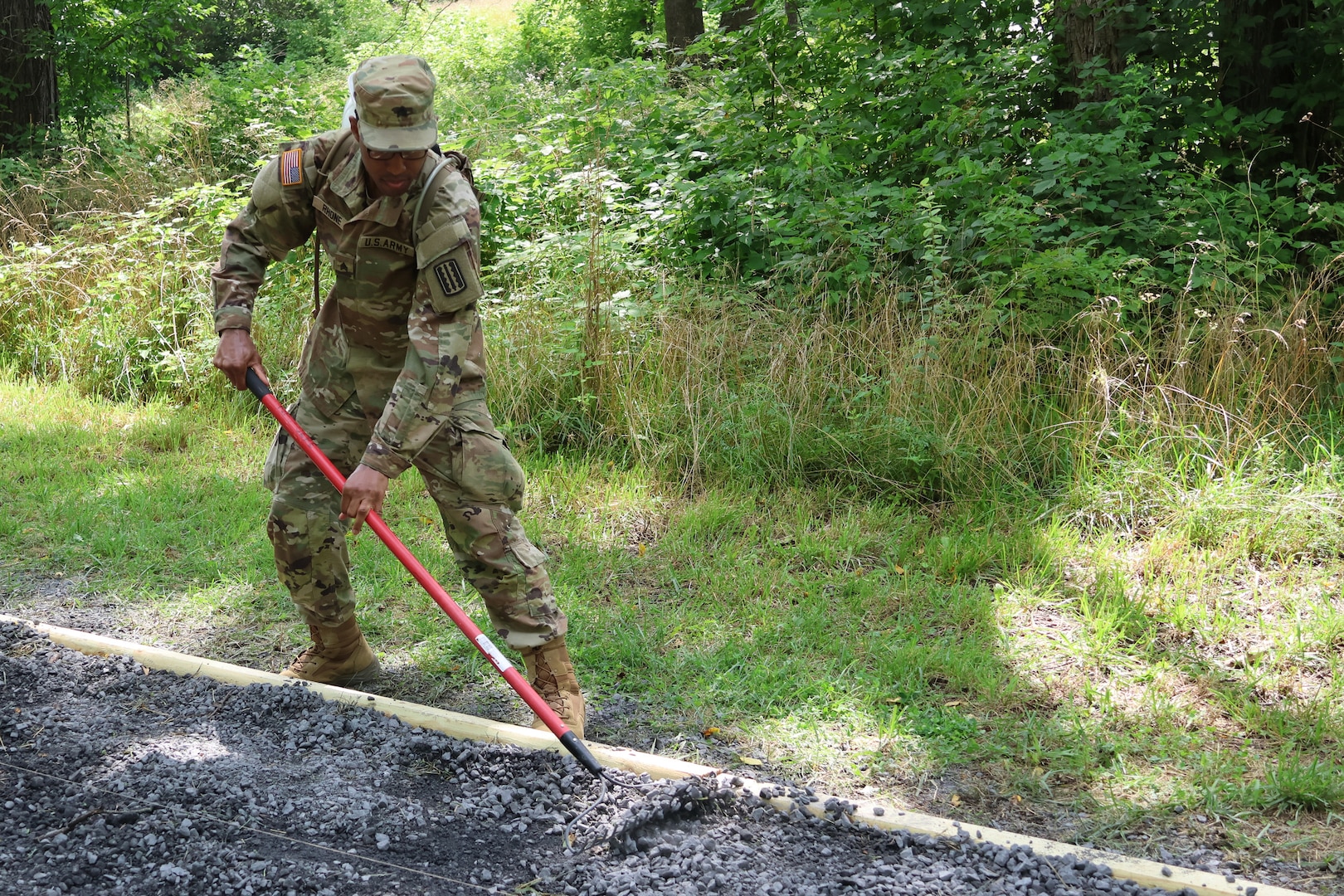 Virginia National Guard leaders from the state, brigade and battalion level visit Soldiers assigned to the Cedar Bluff-based 1033rd Engineer Support Company, 276th Engineer Battalion, 329th Regional Support Group constructing a parking area and walking trail July 21, 2025, at the Cedar Creek & Belle Grove National Historical Park in Middletown, Virginia. The leaders met with U.S. National Park rangers, learned more about the project and the park, thanked Soldiers for their service and presented challenge coins to recognize outstanding duty performance. The project is part of the Innovative Readiness Training program where engineers put their military skills to work on community service projects approved by National Guard Bureau.