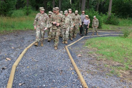 Virginia National Guard leaders from the state, brigade and battalion level visit Soldiers assigned to the Cedar Bluff-based 1033rd Engineer Support Company, 276th Engineer Battalion, 329th Regional Support Group constructing a parking area and walking trail July 21, 2025, at the Cedar Creek & Belle Grove National Historical Park in Middletown, Virginia. The leaders met with U.S. National Park rangers, learned more about the project and the park, thanked Soldiers for their service and presented challenge coins to recognize outstanding duty performance. The project is part of the Innovative Readiness Training program where engineers put their military skills to work on community service projects approved by National Guard Bureau.