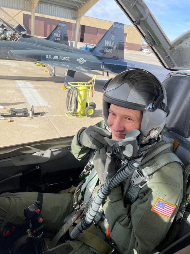 Image of an Airman sitting in an aircraft.