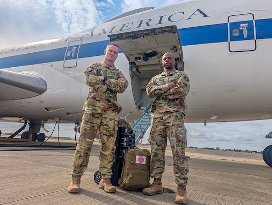 Image of two Airmen posing for a photo.