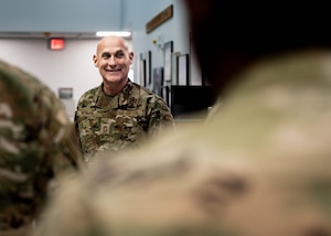 U.S. Air Force Chief Master Sgt. Jamie Newman, Headquarters Air Mobility Command command chief, listens to a brief at the 308th Fighter Squadron
