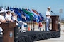 Capt. Christopher E. Wear salutes Capt. Stephen M. Healey as Healey assumes command of Naval Special Warfare Group (NSWG) 11 during a ceremony presided over by Rear Adm. Milton J. Sands III, commander, Naval Special Warfare Command. NSWG-11, a component of U.S. Naval Special Warfare Command, is composed of Navy Reserve SEAL and SWCC units.