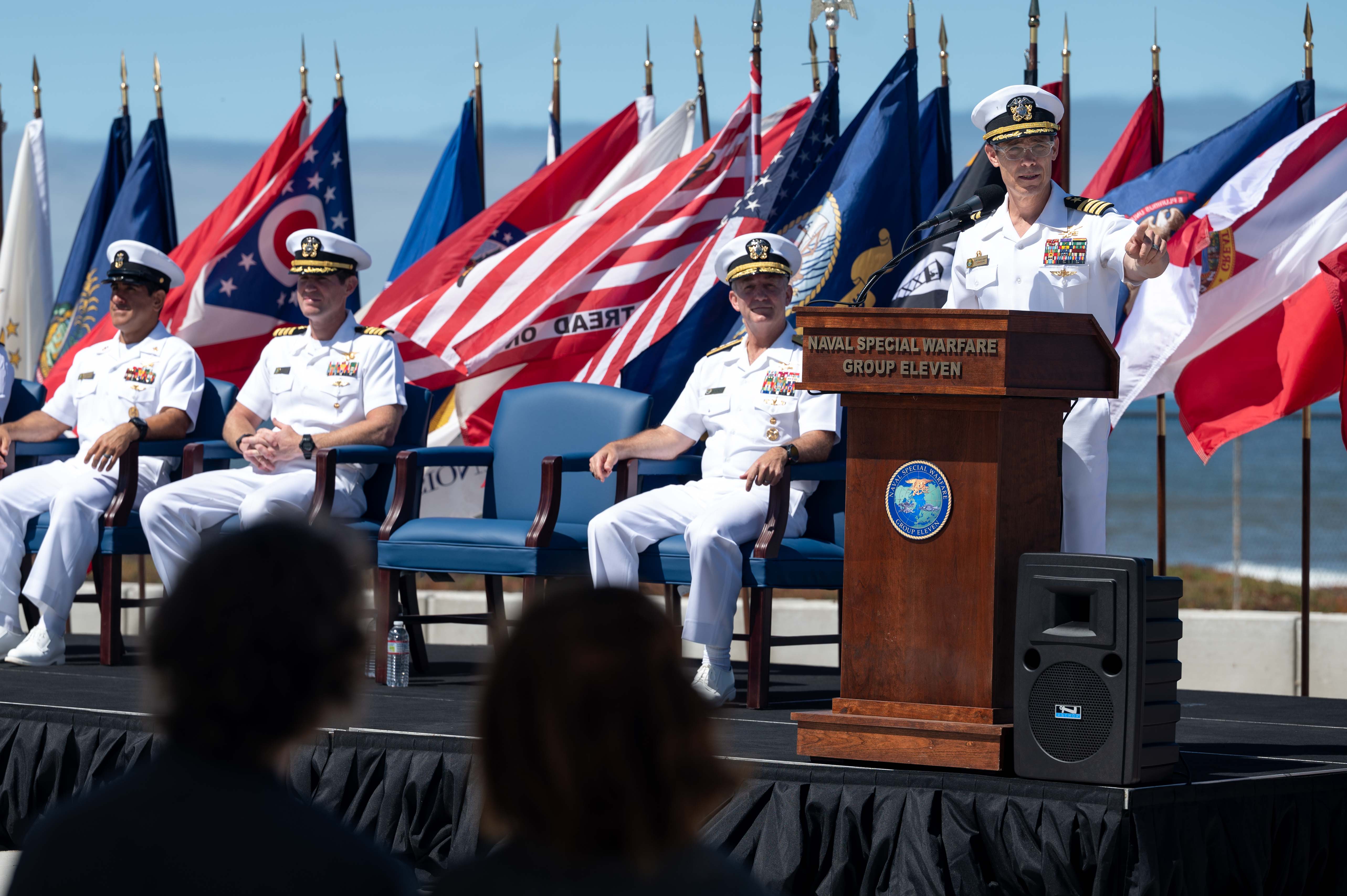 Capt. Christopher E. Wear salutes Capt. Stephen M. Healey as Healey assumes command of Naval Special Warfare Group (NSWG) 11 during a ceremony presided over by Rear Adm. Milton J. Sands III, commander, Naval Special Warfare Command. NSWG-11, a component of U.S. Naval Special Warfare Command, is composed of Navy Reserve SEAL and SWCC units.