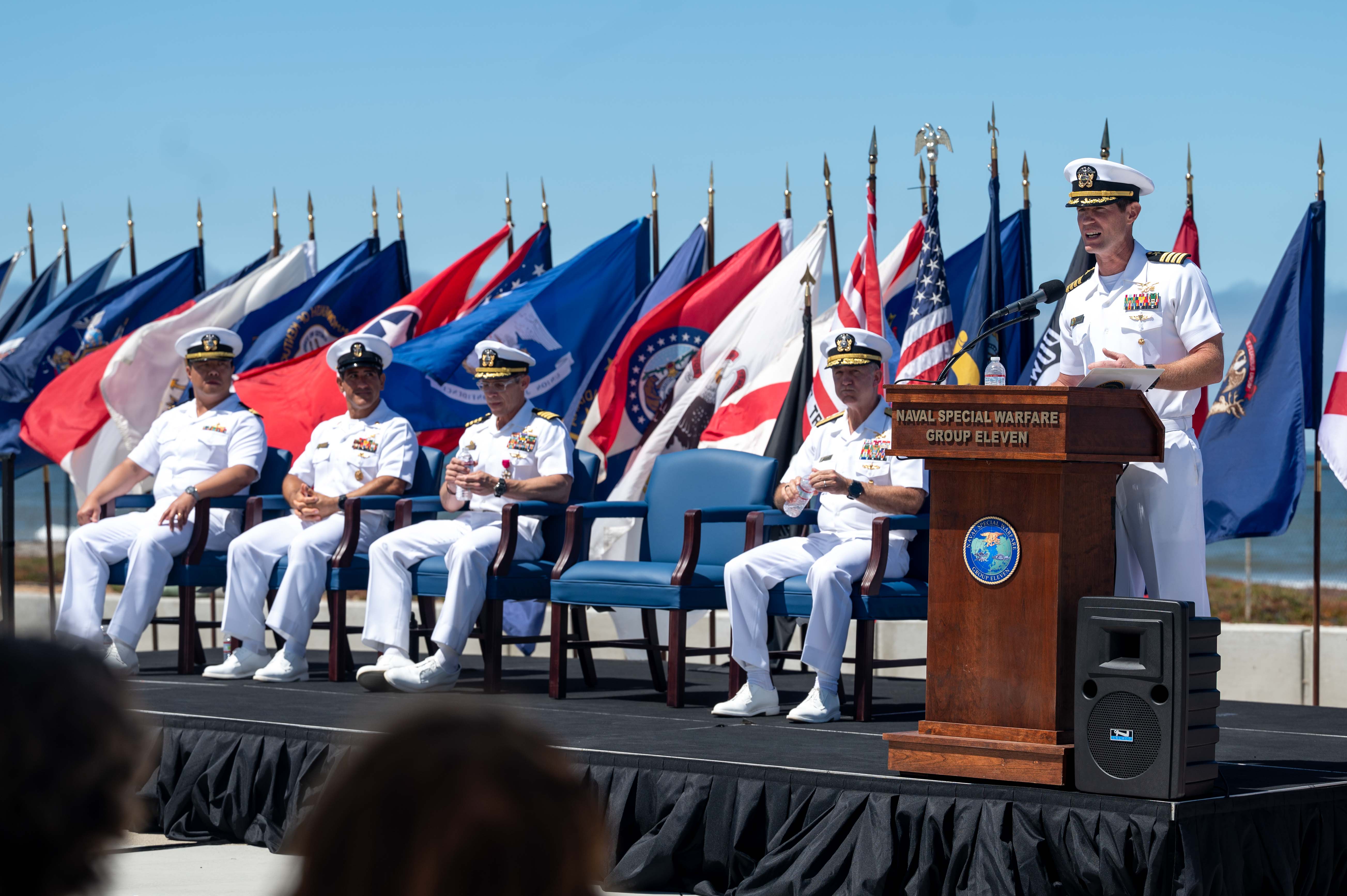 Capt. Christopher E. Wear salutes Capt. Stephen M. Healey as Healey assumes command of Naval Special Warfare Group (NSWG) 11 during a ceremony presided over by Rear Adm. Milton J. Sands III, commander, Naval Special Warfare Command. NSWG-11, a component of U.S. Naval Special Warfare Command, is composed of Navy Reserve SEAL and SWCC units.