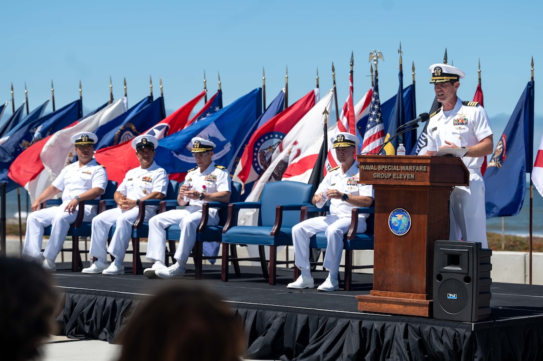 Capt. Christopher E. Wear salutes Capt. Stephen M. Healey as Healey assumes command of Naval Special Warfare Group (NSWG) 11 during a ceremony presided over by Rear Adm. Milton J. Sands III, commander, Naval Special Warfare Command. NSWG-11, a component of U.S. Naval Special Warfare Command, is composed of Navy Reserve SEAL and SWCC units.